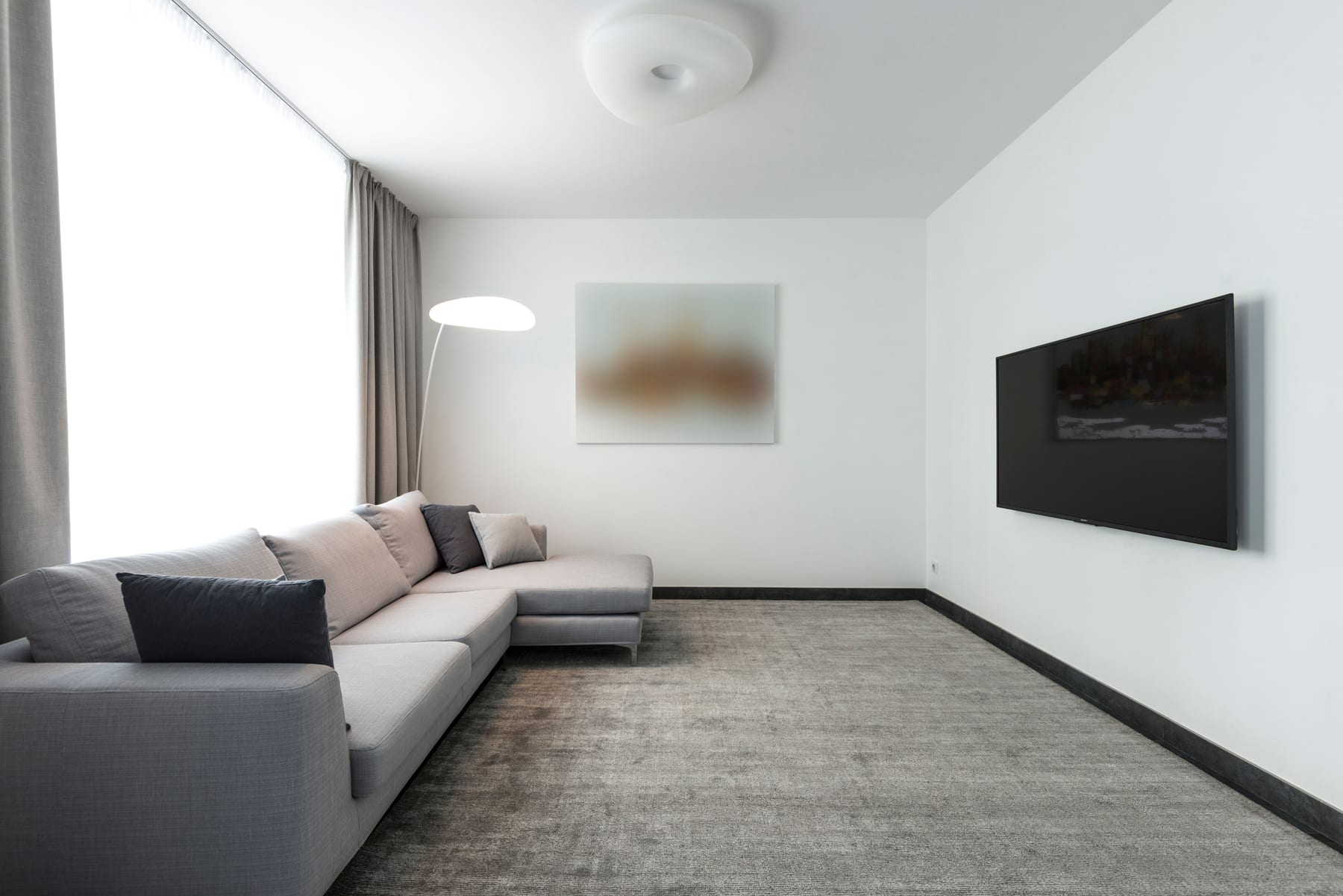 Friendly Capitola Carpet Cleaning technician holding a professional stainless-steel carpet wand